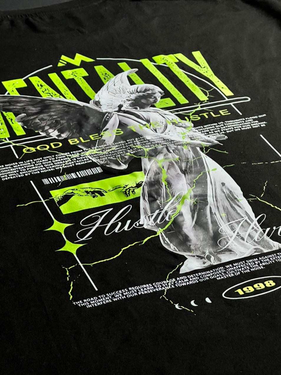 Black t-shirt with graphic design featuring a butterfly and text on a dark background